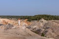 A beautiful woman on the background of landscape.Top view of the quarry