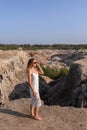 A beautiful woman on the background of landscape.Top view of the quarry