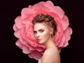 Beautiful woman on the background of a large flower Royalty Free Stock Photo