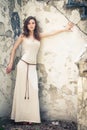 Beautiful woman on background of old wall Royalty Free Stock Photo