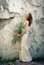 Beautiful woman on background of old wall Royalty Free Stock Photo