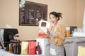 Beautiful woman bakery or coffee shop owner is smiling in her shop