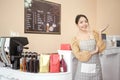 Beautiful woman bakery or coffee shop owner is smiling in her shop