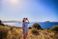 Beautiful woman in beach hat enjoying sea view with blue sky at sunny day in Bodrum, Turkey. Vacation Outdoors Seascape Summer Royalty Free Stock Photo