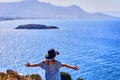 Beautiful woman in beach hat enjoying sea view with blue sky at sunny day in Bodrum, Turkey. Vacation Outdoors Seascape Summer