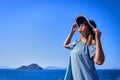 Beautiful woman in beach hat enjoying sea view with blue sky at sunny day in Bodrum, Turkey. Vacation Outdoors Seascape Summer Royalty Free Stock Photo