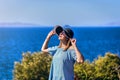 Beautiful woman in beach hat enjoying sea view with blue sky at sunny day in Bodrum, Turkey. Vacation Outdoors Seascape Summer Royalty Free Stock Photo