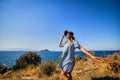 Beautiful woman in beach hat enjoying sea view with blue sky at sunny day in Bodrum, Turkey. Vacation Outdoors Seascape Summer Royalty Free Stock Photo