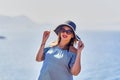 Beautiful woman in beach hat enjoying sea view with blue sky at sunny day in Bodrum, Turkey. Vacation Outdoors Seascape Summer Royalty Free Stock Photo