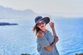 Beautiful woman in beach hat enjoying sea view with blue sky at sunny day in Bodrum, Turkey. Vacation Outdoors Seascape Summer Royalty Free Stock Photo