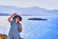 Beautiful woman in beach hat enjoying sea view with blue sky at sunny day in Bodrum, Turkey. Vacation Outdoors Seascape Summer Royalty Free Stock Photo