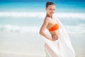 Beautiful woman on the beach in orange bikini Royalty Free Stock Photo