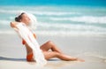 Beautiful woman on the beach in orange bikini Royalty Free Stock Photo