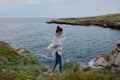 beautiful woman beach tourism cloudy weather stone coast Lifestyle Royalty Free Stock Photo