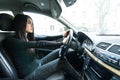 Beautiful woman beep in the car in panic while drive Royalty Free Stock Photo