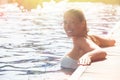 Enjoy the summer. Woman relaxing in the pool water Royalty Free Stock Photo