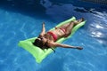 beautiful woman in bikini lying relax on float airbed at vacacti Royalty Free Stock Photo