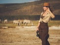 Beautiful woman with binoculars at savanna in Kenya Royalty Free Stock Photo