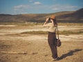 Beautiful woman with binoculars at savanna in Kenya Royalty Free Stock Photo