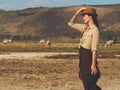 Beautiful woman with binoculars at savanna in Kenya Royalty Free Stock Photo