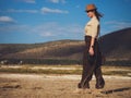 Beautiful woman with binoculars at savanna in Kenya Royalty Free Stock Photo