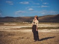 Beautiful woman with binoculars at savanna in Kenya Royalty Free Stock Photo