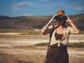 Beautiful woman with binoculars at savanna in Kenya Royalty Free Stock Photo