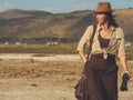 Beautiful woman with binoculars at savanna in Kenya Royalty Free Stock Photo