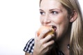 Beautiful woman biting a fresh apple Royalty Free Stock Photo