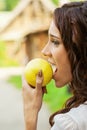 Beautiful woman biting green apple Royalty Free Stock Photo