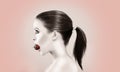 Beautiful woman biting strawberry Royalty Free Stock Photo