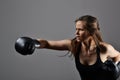 Beautiful woman with the black boxing gloves