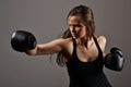 Beautiful woman with the black boxing gloves