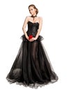 Beautiful Woman In Black Evening Gown holding Red Rose, Vintage Fashion Corset Chiffon Dress Cut Out White Royalty Free Stock Photo