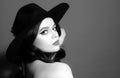 Beautiful woman in black hat. Sensual retro fashion. Isolated. High-fashion portrait. Royalty Free Stock Photo