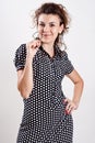 Beautiful woman in a black polka dot dress