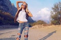 Beautiful woman with blond hair in casual clothes, posing on road Royalty Free Stock Photo