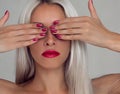 Beautiful woman with blond hair. Fashion model with red lipstick and red nails Royalty Free Stock Photo