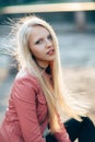 Beautiful woman blond portrait with wind in her hair on sunny da Royalty Free Stock Photo