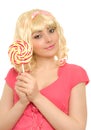 Beautiful woman in blond wig with lollipop Royalty Free Stock Photo