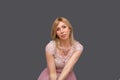 Beautiful woman blonde fashion model in a pink dress with perfect make-up Royalty Free Stock Photo