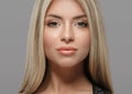 Beautiful woman blonde hair portrait close up studio on gray Royalty Free Stock Photo