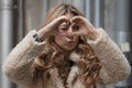 Beautiful woman with blonde long hair and blue eyes wanders the streets of Istanbul and poses for the camera