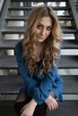 Beautiful woman with blonde long hair and blue eyes wanders the streets of Istanbul and poses for the camera