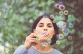 Beautiful woman blowing bubbles Royalty Free Stock Photo