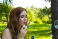 Beautiful woman blowing bubbles in the sun Royalty Free Stock Photo