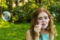 Beautiful woman blowing bubbles in the sun Royalty Free Stock Photo