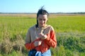 Beautiful woman blowing dandelion on the meadow Royalty Free Stock Photo