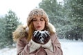 Beautiful woman blowing snow Royalty Free Stock Photo