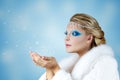 Beautiful Woman Blowing Snow Royalty Free Stock Photo